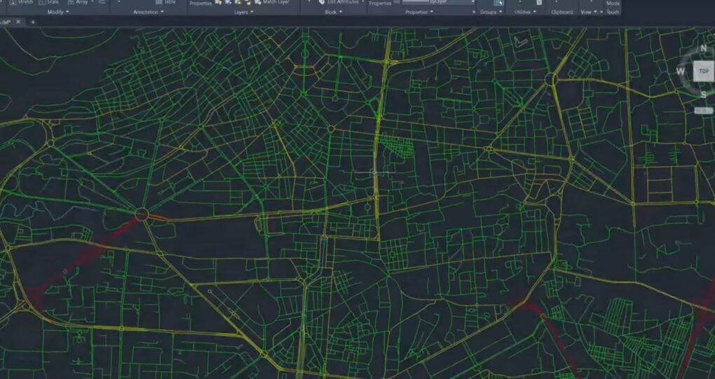 A dark mode GIS interface displaying a complex city street network with multiple layers