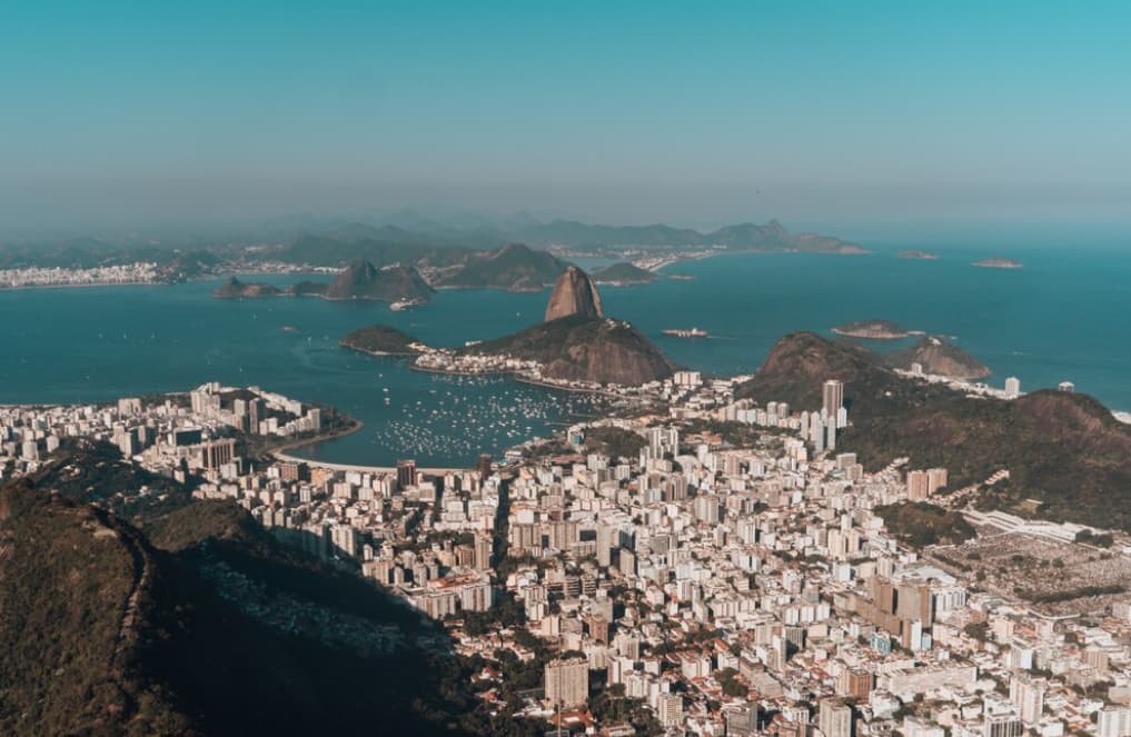 Aerial photo of rio de janeiro surrounded by the sea and hills under the sunlight in brazil