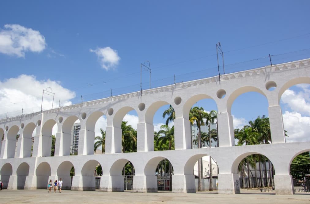 Low angle shot of white building selaron steps in rio de janeiro, cloudy sky behind