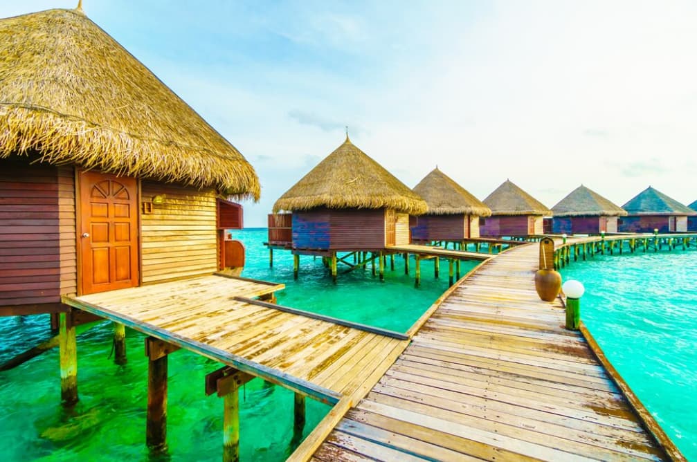 Overwater bungalows with a vibrant wooden walkway