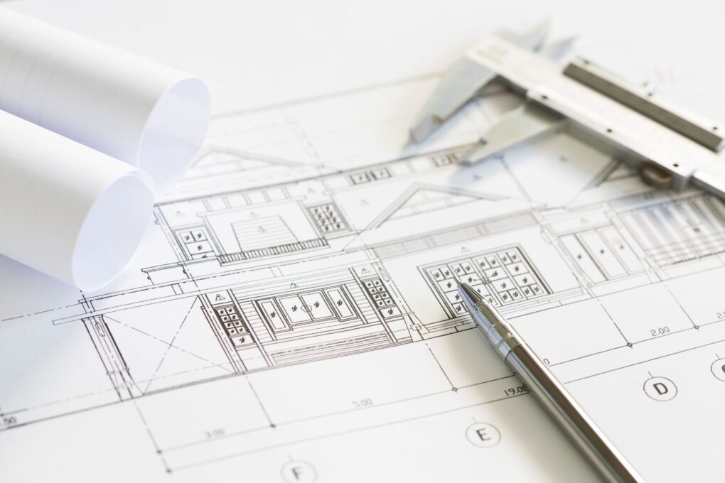 Close up of construction plans and drawing tools