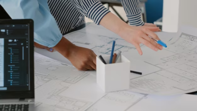 Two people working on an architectural project